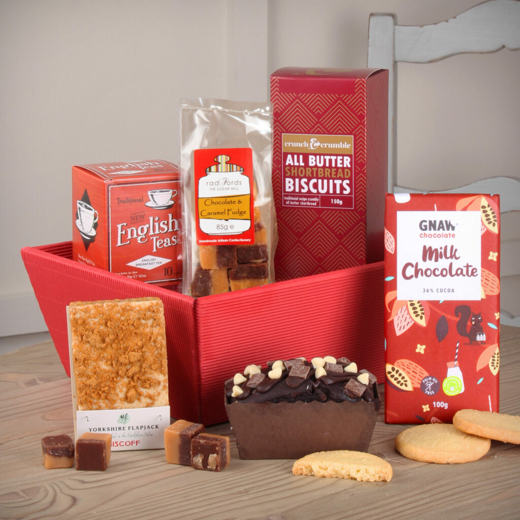 Tea & Treats Gift Hamper in a Red kraft tray. Chocolates, Tea Cake and others
