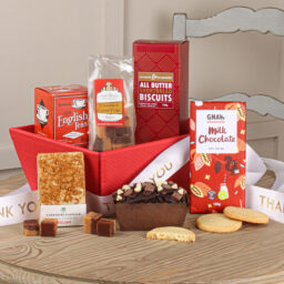 Thank you Gift Hamper. A selection of food items in a strudy kraft tray. Ribboned Gift to say thank you.